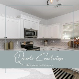 kitchen with ample counter-space, modern appliances and bright lighting