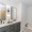 bathroom showing decor and a large mirror